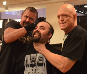Host Jay K with horror icons Kane Hodder and Michael Berryman